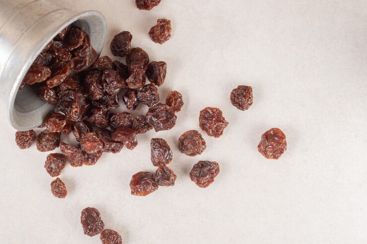 dried-brown-cherries-metallic-cup_114579-25239